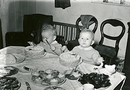 The Miles twins celebrate their birthday with cakes and crackers (1952)