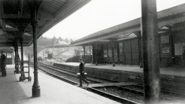 Railway employee crosses the track at Midhurst Station.