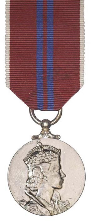Example image of a coronation medal which has a red and blue ribbon and silver medal with Elizabeth II's portrait on it.
