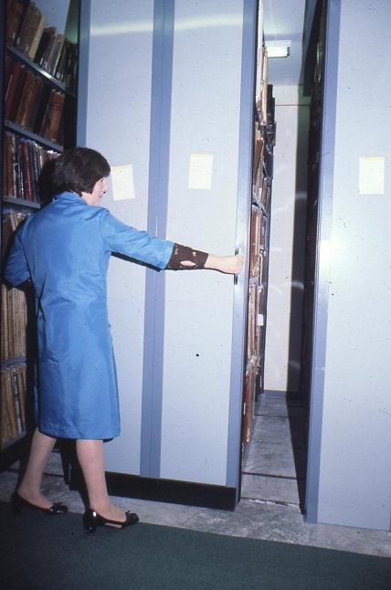 Member of WSRO staff moving mobile racking