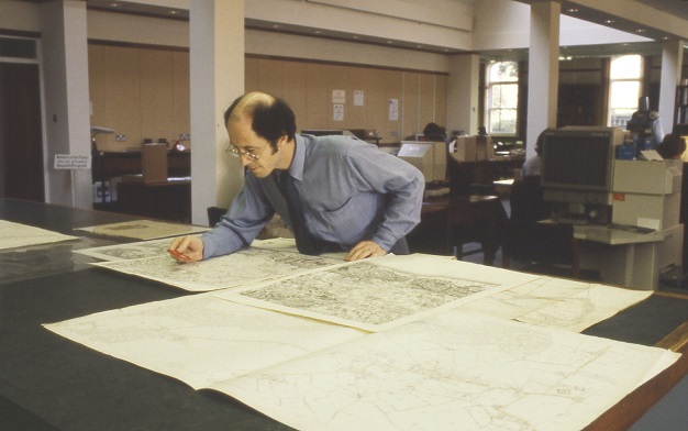 Consulting maps with a magnifying glass