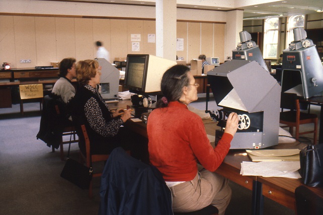 Researchers using microfilm readers
