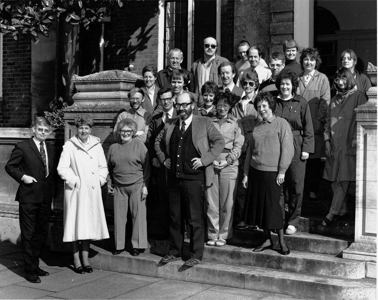 Black and white photograph of staff gathered in a group