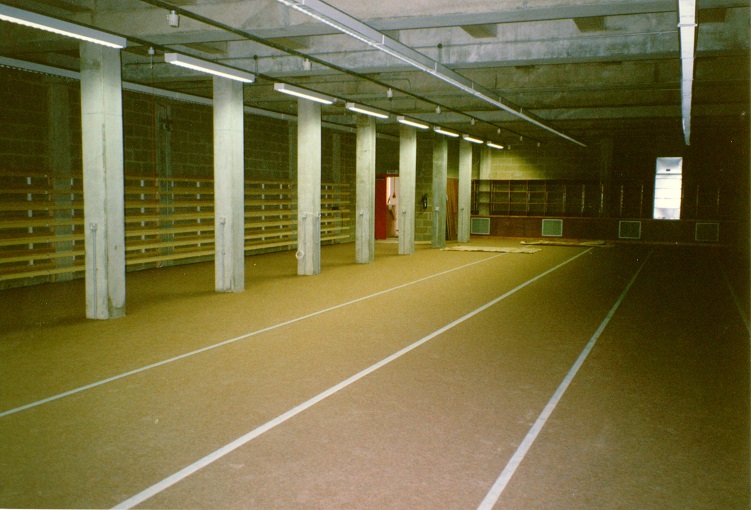 Colour photograph showing the concrete pillars and ceiling and tithe / rolled map storage along the wall