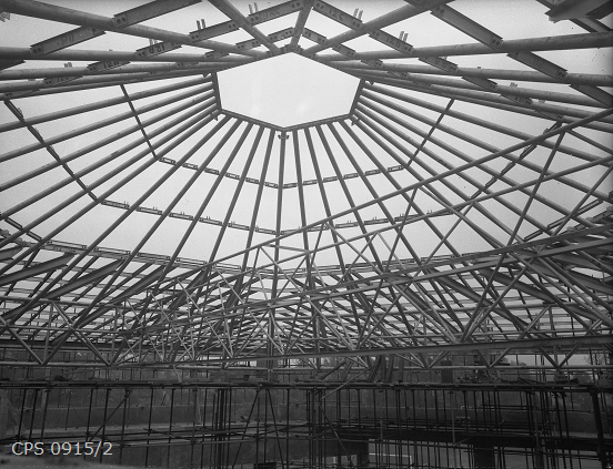 A spectacular black and white photograph of the underside of the Chichester Festival Theatre's roof structure before it had been covered.
