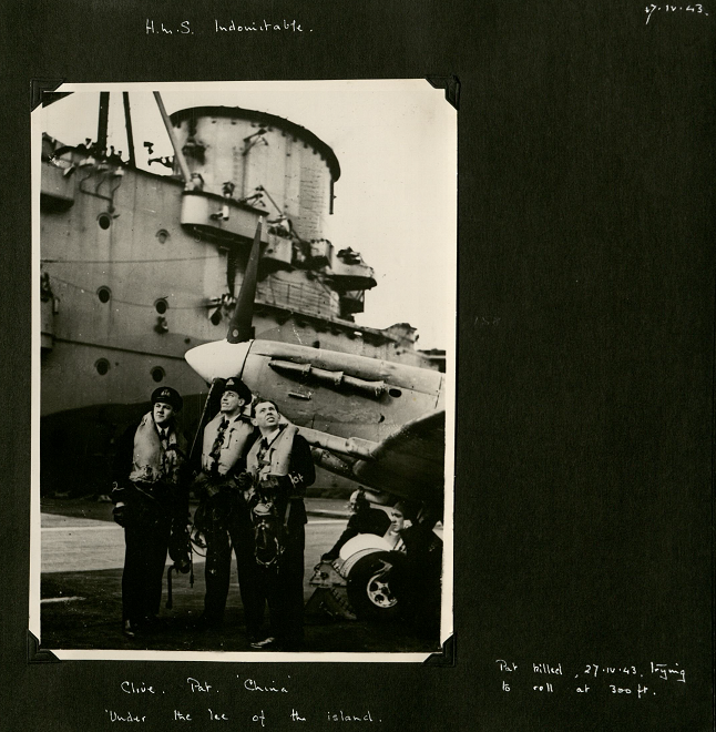 Three pilots in uniform standing at the nose of the plane on the aircraft carrier. The photo is portrait and in black and white. On the back: 'Illustrated Copyright Photograph' [Illustrated London News].