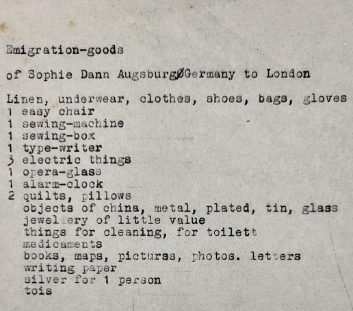 Goods of Sophie Dann includes Linen, underwear, clothes, shoes, bags, gloves, 1 easy chair, 1 sewing machine, 1 sewing box, 1 type writer, 3 electric things, 1 opera gladd, 1 alarm clock, 2 quilts, pillows, objects of china, metal, plated, tin, glass jewellery of little value etc. etc.