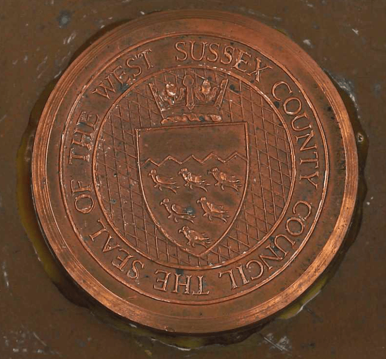 Metal impression of the county council seal, used for wax or ink seals.